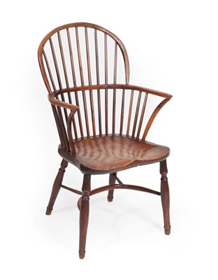 Lot 553 - A Mid 19th Century Yew Windsor Armchair, the double spindle back support with curved arm...