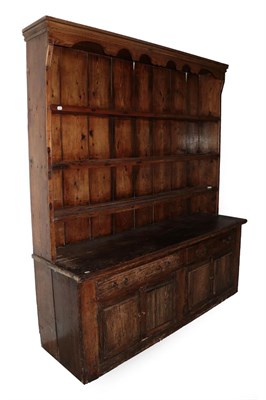 Lot 554 - An 18th Century Provincial Pine and Elm Enclosed Dresser and Rack, the rack with a wavy shaped...