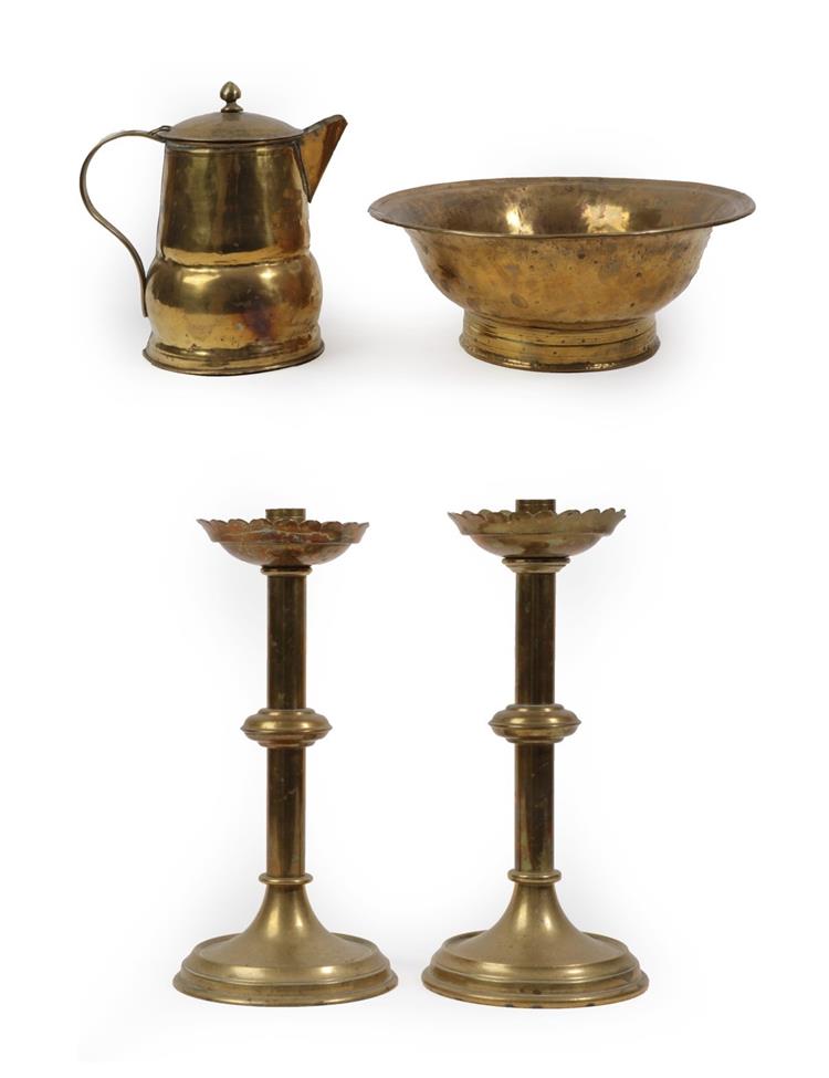 Lot 557 - A Brass Covered Jug and Basin, 17th/18th century, the jug with strap handle and acorn knop, the...