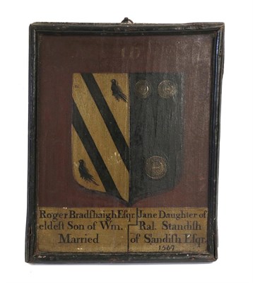 Lot 560 - A Painted Oak Marriage Plaque, dated 1567, painted with an armorial and inscribed Roger...