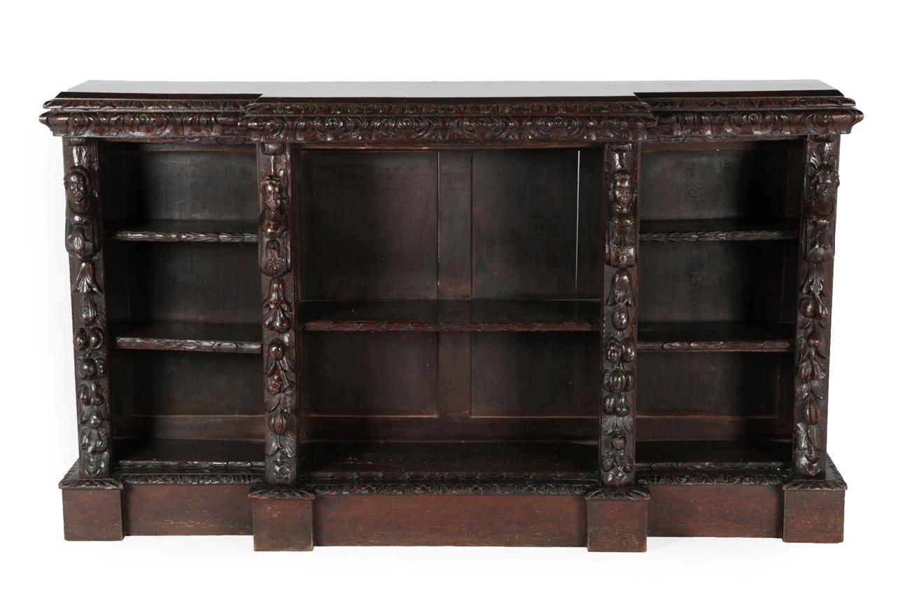 Lot 561 - A Victorian Carved Oak Free-Standing Breakfront Bookcase, 3rd quarter 19th century, the carved...