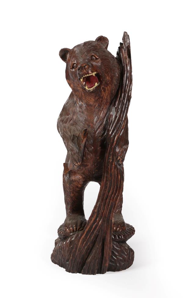 Lot 566 - A Carved Oak Bear Figure, late 19th century, realistically modelled standing on its hind legs...