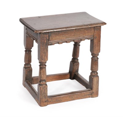 Lot 568 - A Late 17th Century Oak Joint Stool, the six peg rectangular top above a moulded and...
