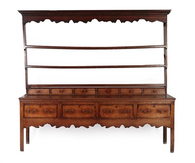 Lot 569 - An Oak and Mahogany Crossbanded Dresser and Rack, the rack with wavy shaped apron and three...