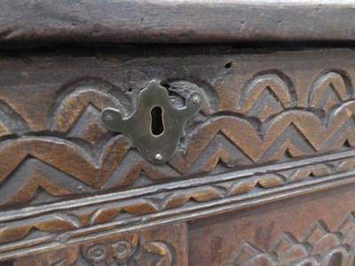 Lot 577 - A 16th Century Joined Oak Chest, the panelled and hinged lid above a carved frieze with two...