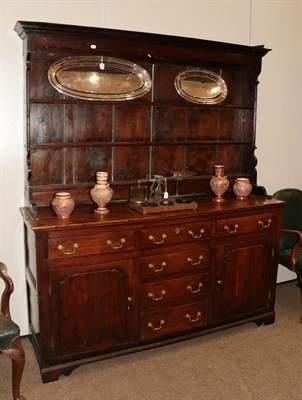 Lot 581 - A George III Oak and Pine Lined Enclosed Dresser, late 18th/early 19th century, the rack with...