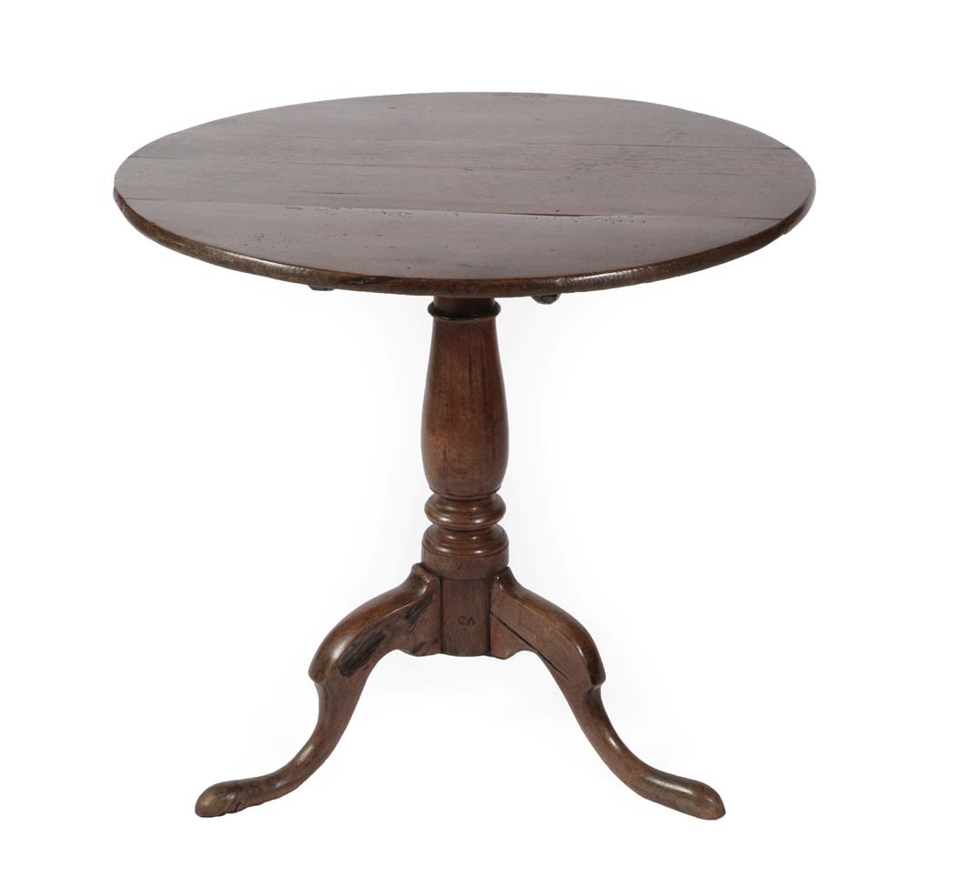 Lot 583 - A George III Oak Tripod Table, late 18th century, of circular form with vasiform turned...