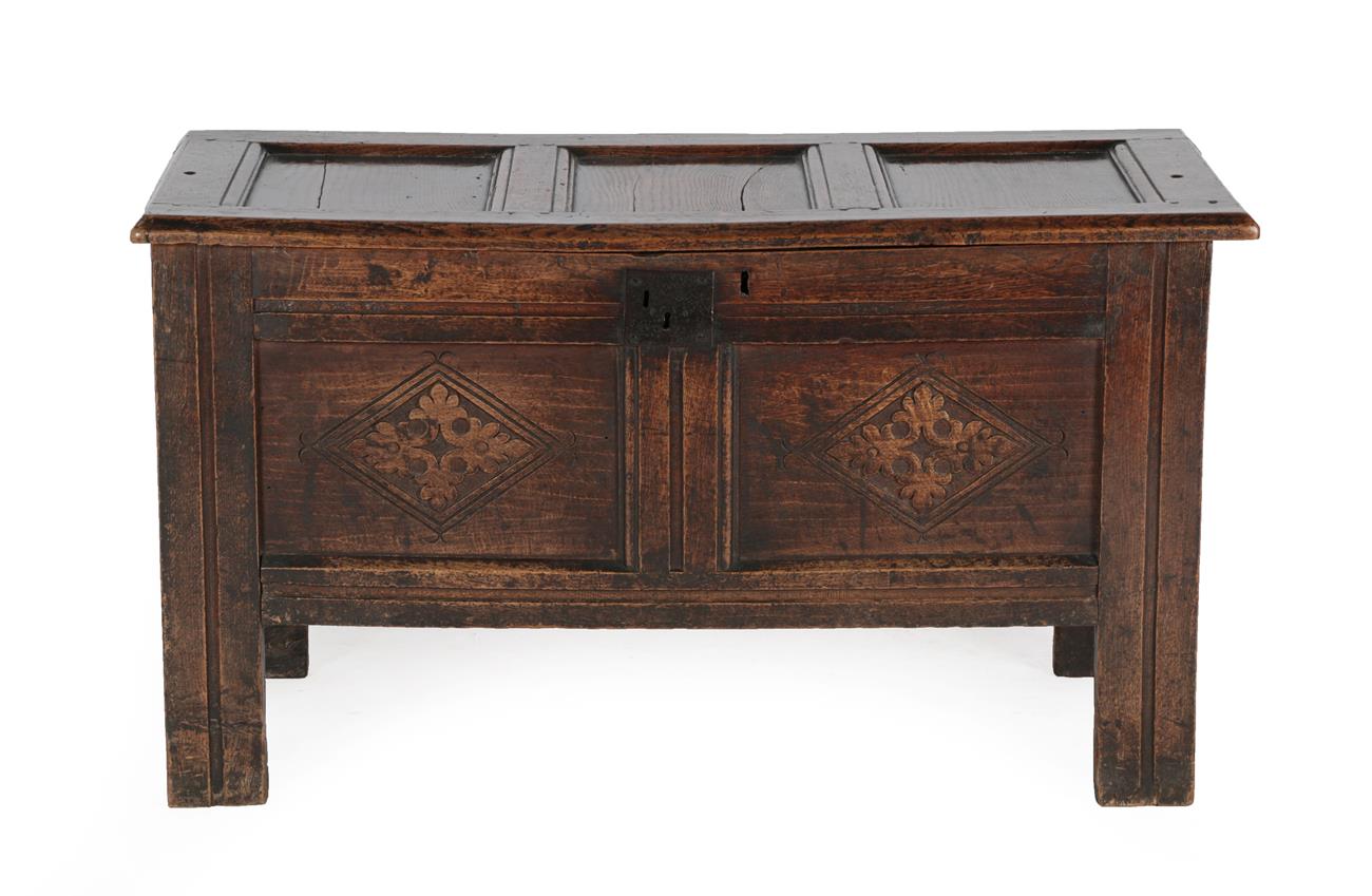 Lot 588 - A Late 17th Century Joined Oak Chest, the hinged lid with three moulded panels above an iron...