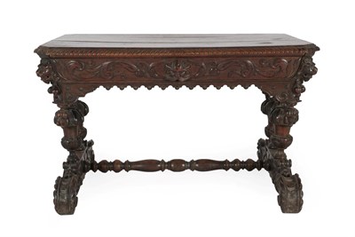 Lot 599 - A Victorian Carved Oak Library Table, 3rd quarter 19th century, of rectangular canted form with...