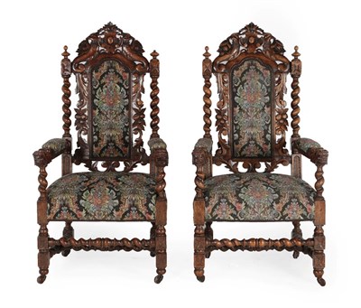 Lot 606 - A Pair of Victorian Carved Oak Armchairs, late 19th century, later recovered in floral fabric, with