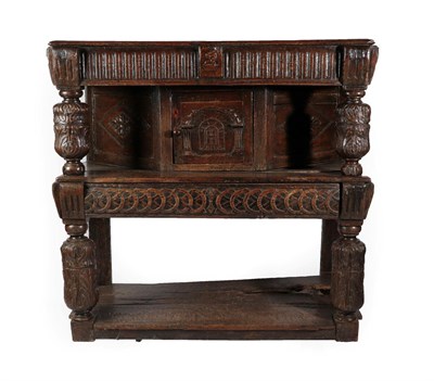 Lot 613 - A Joined Oak Livery Cupboard, the boarded top above a nulled frieze with carved bulbous...