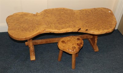 Lot 623 - A Burr Oak Coffee Table, of naturalistic shaped form, on trestle end supports with sledge bases...