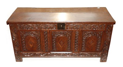 Lot 624 - A Late 17th Century Joined Oak Chest, the hinged lid above an iron lockplate and three carved...