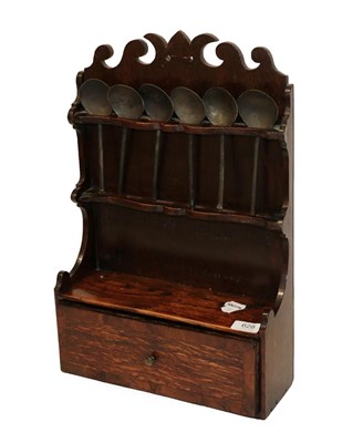 Lot 628 - An 18th Century Oak Spoon Rack, the back panel with scrolled pediment and two serpentine shaped...