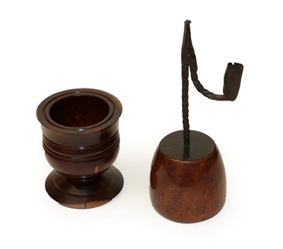 Lot 630 - An 18th Century Wrought Iron Rushnip and Candle Holder, mounted on a fruitwood base, 24cm high; and