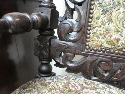 Lot 634 - A Set of Ten Victorian Carved Oak Dining Chairs, circa 1880, including two carvers, recovered...