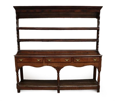 Lot 638 - A George III Oak Open Dresser and Rack, 3rd quarter 18th century, the rack with a bold cornice...