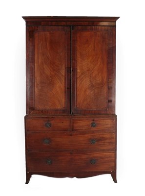 Lot 649 - A George III Mahogany, Crossbanded and Ebony Strung Linen Press, late 18th century, the moulded...