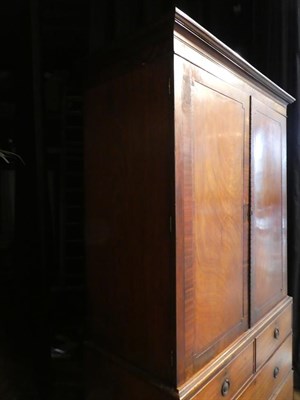 Lot 649 - A George III Mahogany, Crossbanded and Ebony Strung Linen Press, late 18th century, the moulded...
