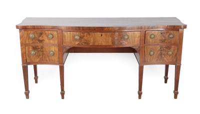 Lot 657 - A George III Mahogany Serpentine Shaped Sideboard, late 18th century, the central bowfront...