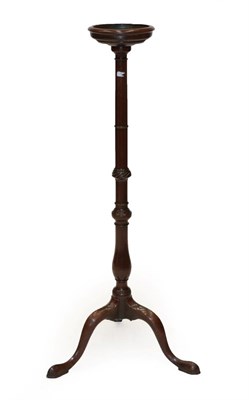 Lot 660 - A George III Mahogany Candle Stand, 3rd quarter 18th century, the circular top above a baluster and