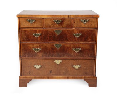 Lot 663 - A Queen Anne Walnut and Feather-Banded Straight Front Chest of Drawers, early 18th century,...