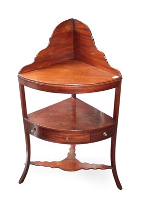 Lot 669 - A George III Mahogany Washstand, circa 1800, of bowfront form with gallery back the three dummy...