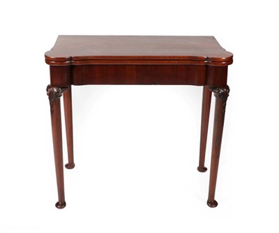 Lot 694 - A George II Style Mahogany Foldover Gaming Table, 19th century, the hinged leaf enclosing a...