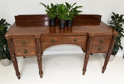 Lot 705 - An Early 19th Century Mahogany Breakfront Sideboard, the gallery back above a central frieze drawer