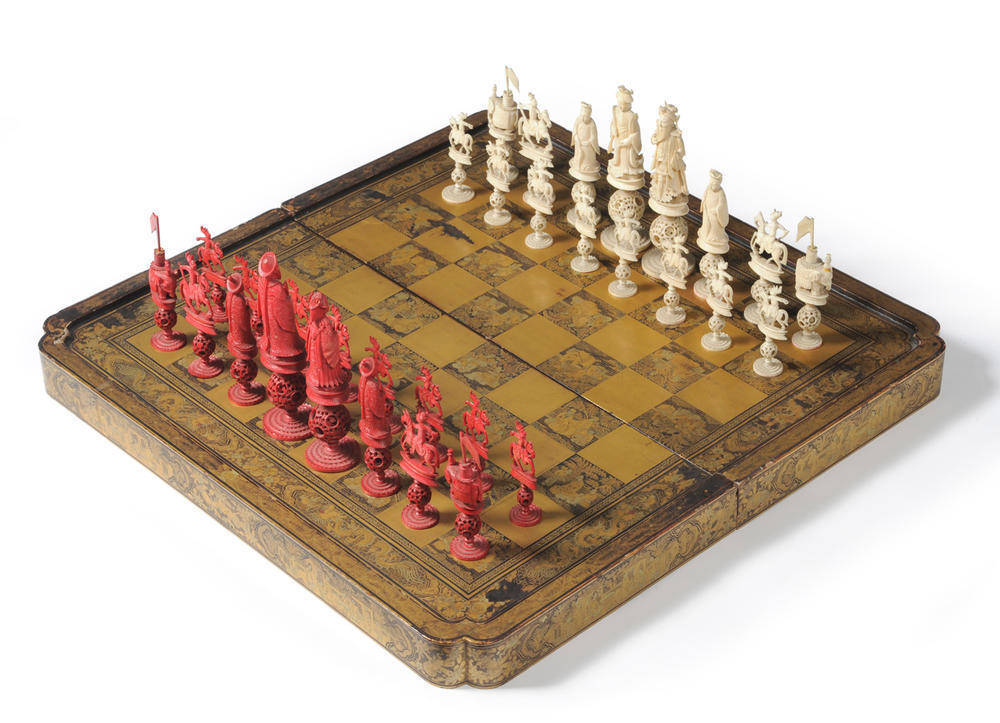 Lot 989 - A Chinese Export Gold Lacquer Folding Chess and Backgammon Board with Chess Set, Qing Dynasty,...