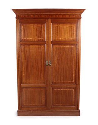 Lot 714 - An Edwardian Mahogany and Satinwood Banded Double-Door Wardrobe, with panelled cupboard doors...