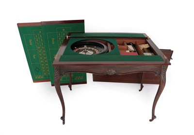 Lot 719 - An Edwardian Mahogany Metamorphic Games Table, the moulded rectangular top lifting off to...