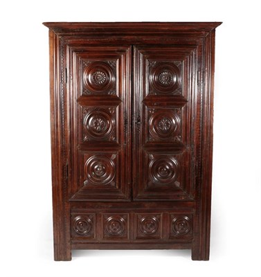 Lot 748 - A 17th Century French Walnut Armoire, of pegged construction, the moulded cornice above two...