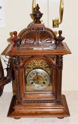 Lot 12 - A late 19th century walnut striking mantel clock, movement stamped Junghans