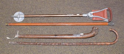 Lot 25 - A Mallaca walking cane with white metal/Indian mount, a shooting stick, a club, and a walking...