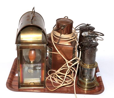 Lot 51 - A Bedlington miners lamp, two Eccles miners lamps, a ships copper lamp and a brass lamp (5)