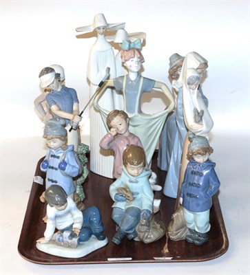 Lot 114 - A collection of eleven Nao figures, together with a single Lladro figure of two nuns, and a...