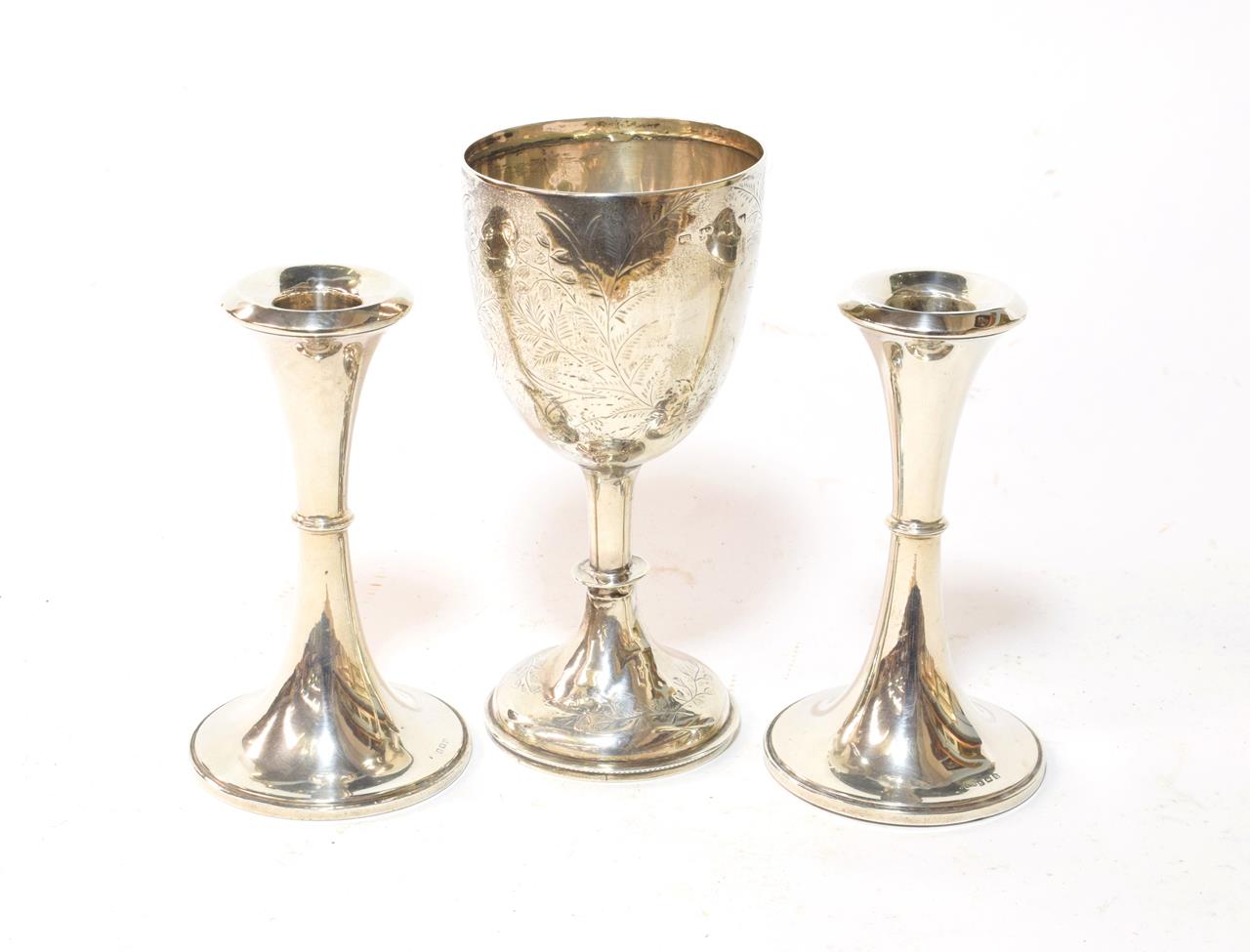 Lot 137 - A pair of George V silver candlesticks, Birmingham, 1916, trumpet-shaped, filled, 15.5cm high,...