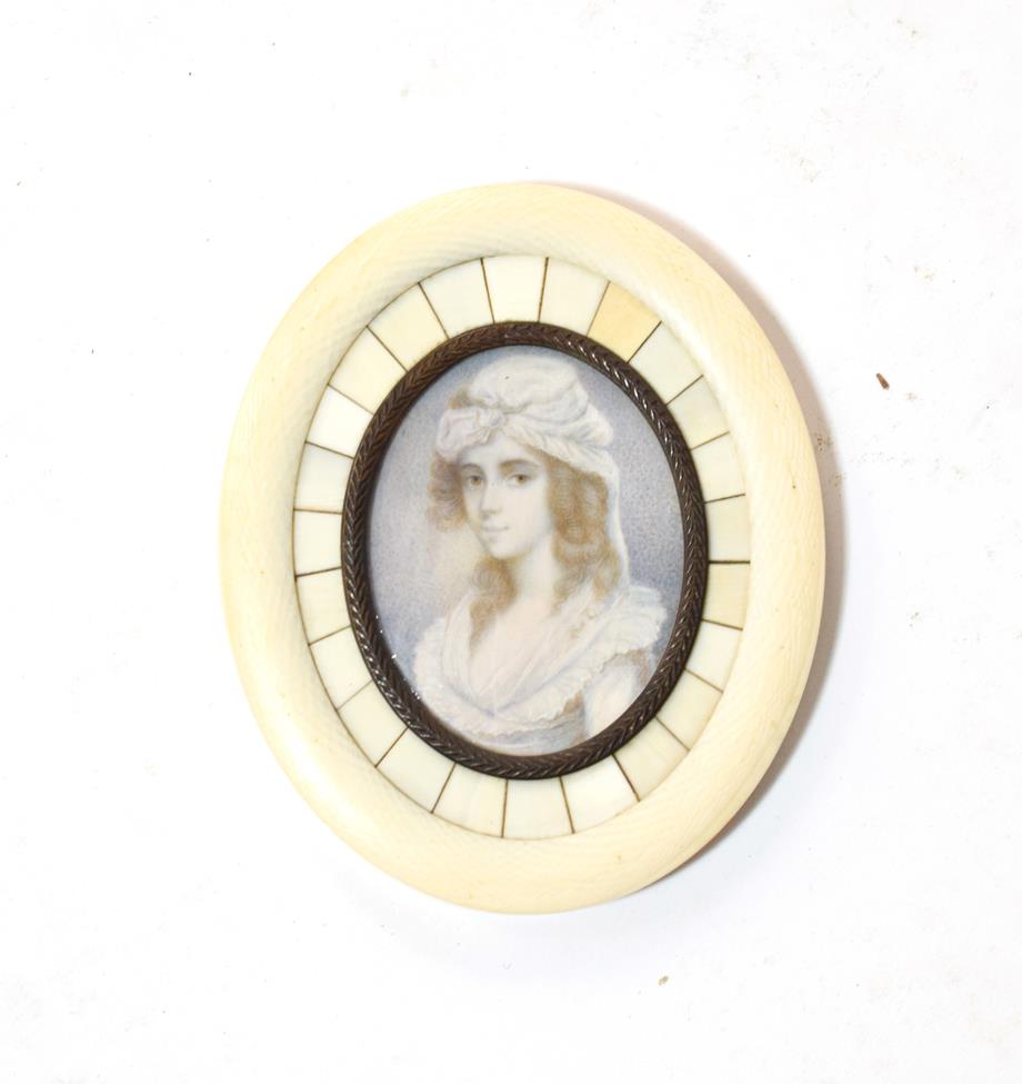 Lot 161 - A 19th century portrait miniature in ivory and bronze frame, possibly French
