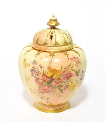 Lot 162 - A Royal Worcester Blush Ivory pot pourri vase complete with covers, decorated with flowers