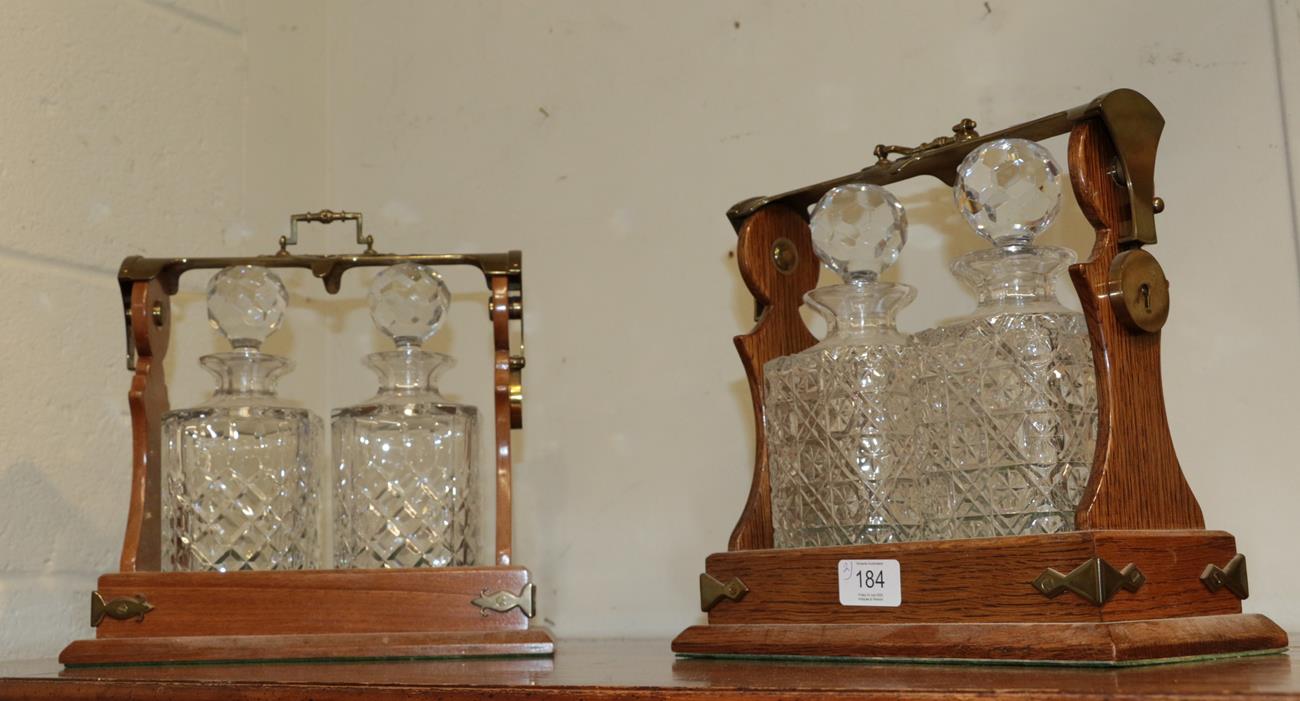 Lot 184 - A pair of two bottle oak and brass tantalus