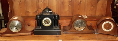 Lot 189 - Three chiming mantle clocks together with a black slate mantel clock with a later battery...
