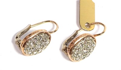 Lot 213 - A pair of diamond cluster earrings, the oval plaque set throughout with rose cut diamonds in a...