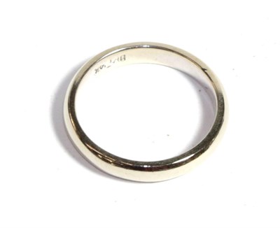 Lot 214 - A white band ring, stamped '14K', finger size K