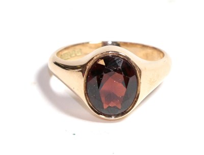 Lot 225 - A 9 carat gold garnet solitaire ring, finger size U1/2