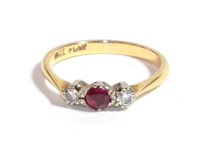 Lot 227 - A synthetic ruby and diamond three stone ring, stamped '18CT' and 'PLAT', finger size M1/2