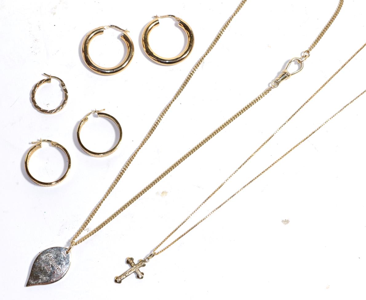 Lot 251 - Two pairs of hoop earrings, stamped '375'; an odd hoop earring, stamped '375'; a 9 carat gold cross
