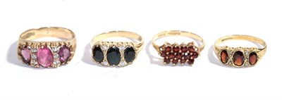 Lot 255 - Four 9 carat gold gem set dress rings including garnet examples, various finger sizes
