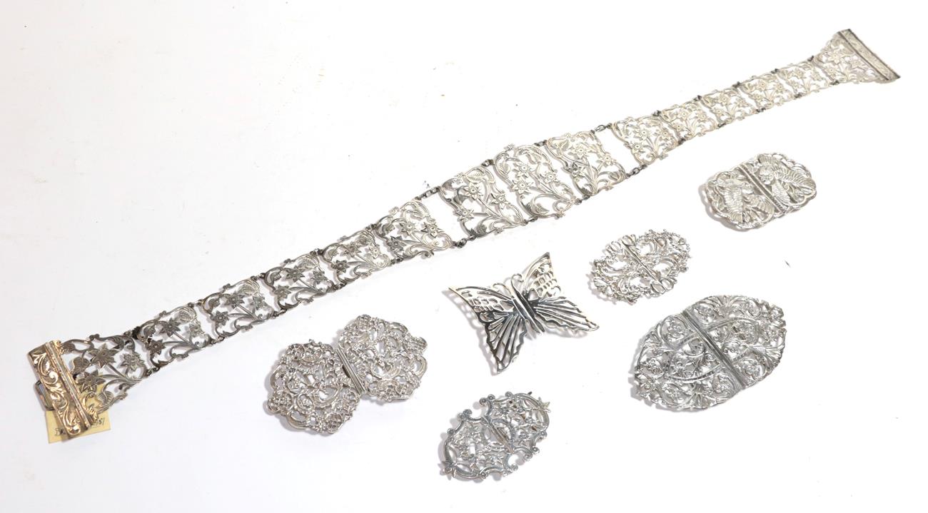 Lot 276 - An Edward VII silver belt, three Elizabeth II silver buckles, a further continental silver...