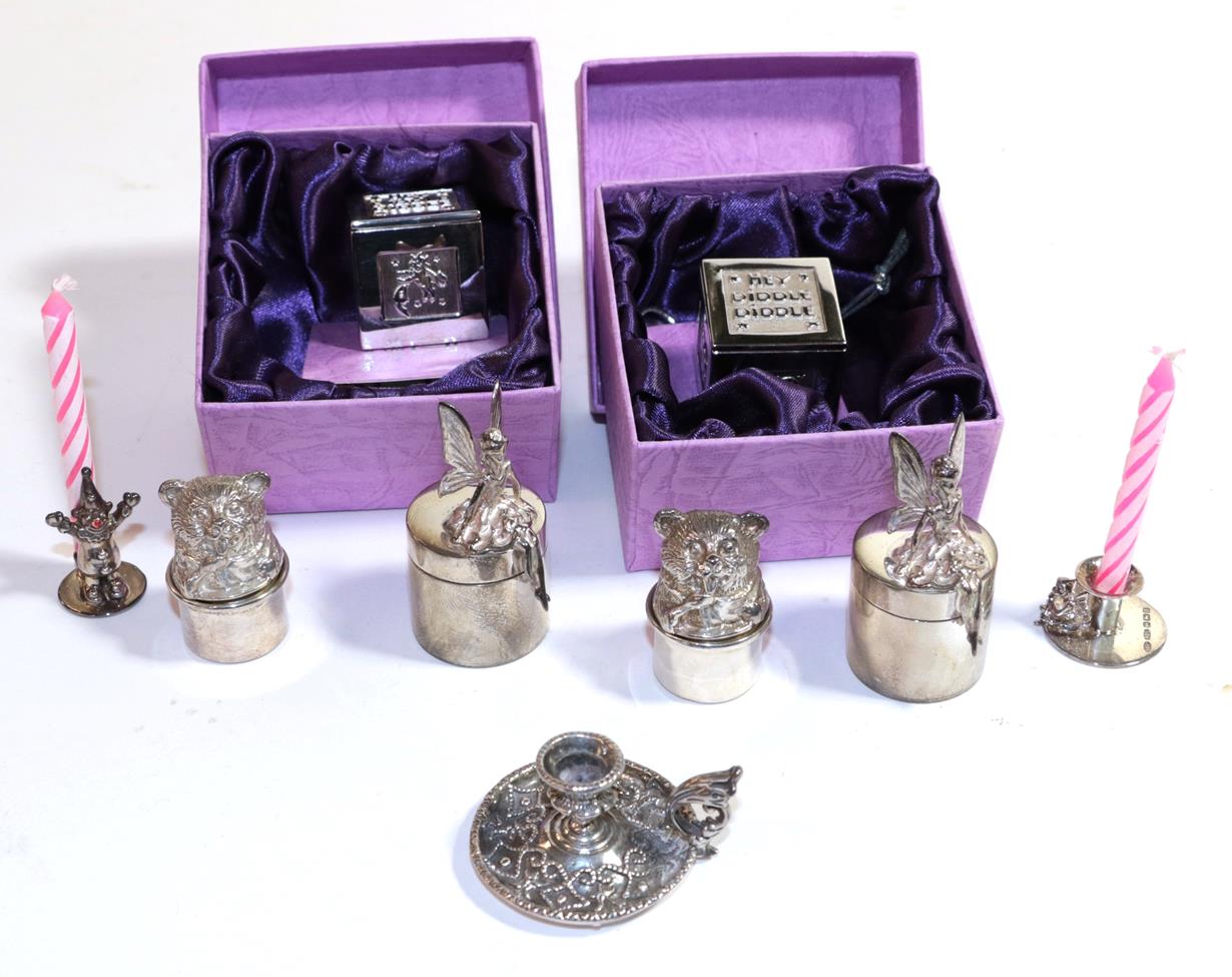 Lot 285 - A quantity of children's silver, comprising: three pairs of tooth boxes, one modelled as a toy box